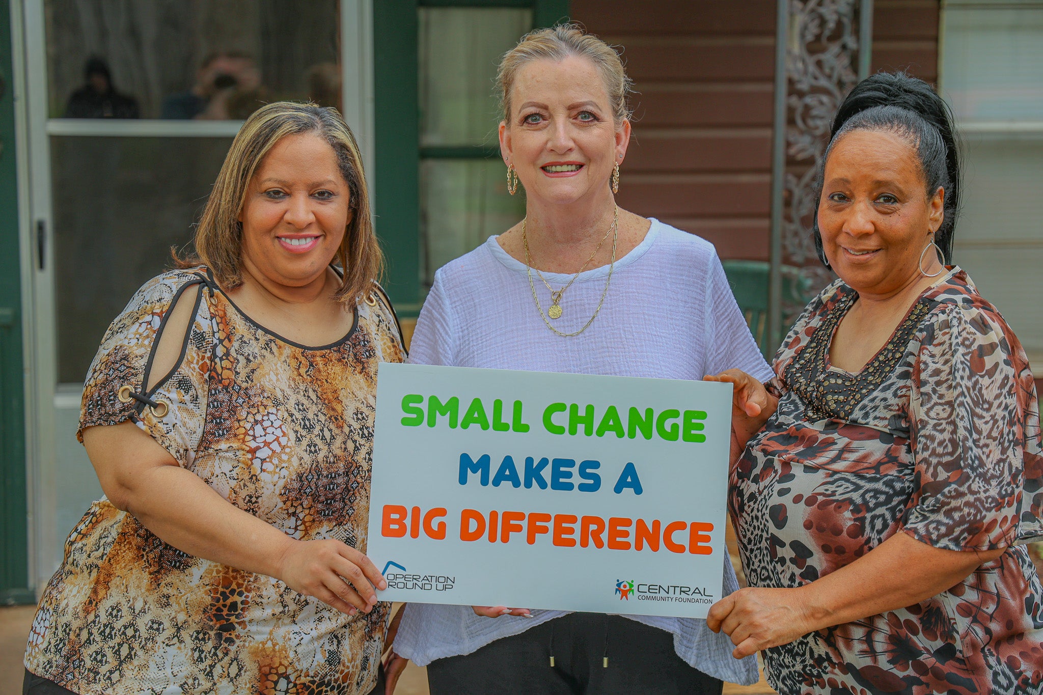 Central Community Foundation board member, Gretchen Harlow, presents a grant to Kimberly Battle, founder and Vice President, and Marri Battle, founder and President of The Chosen House.