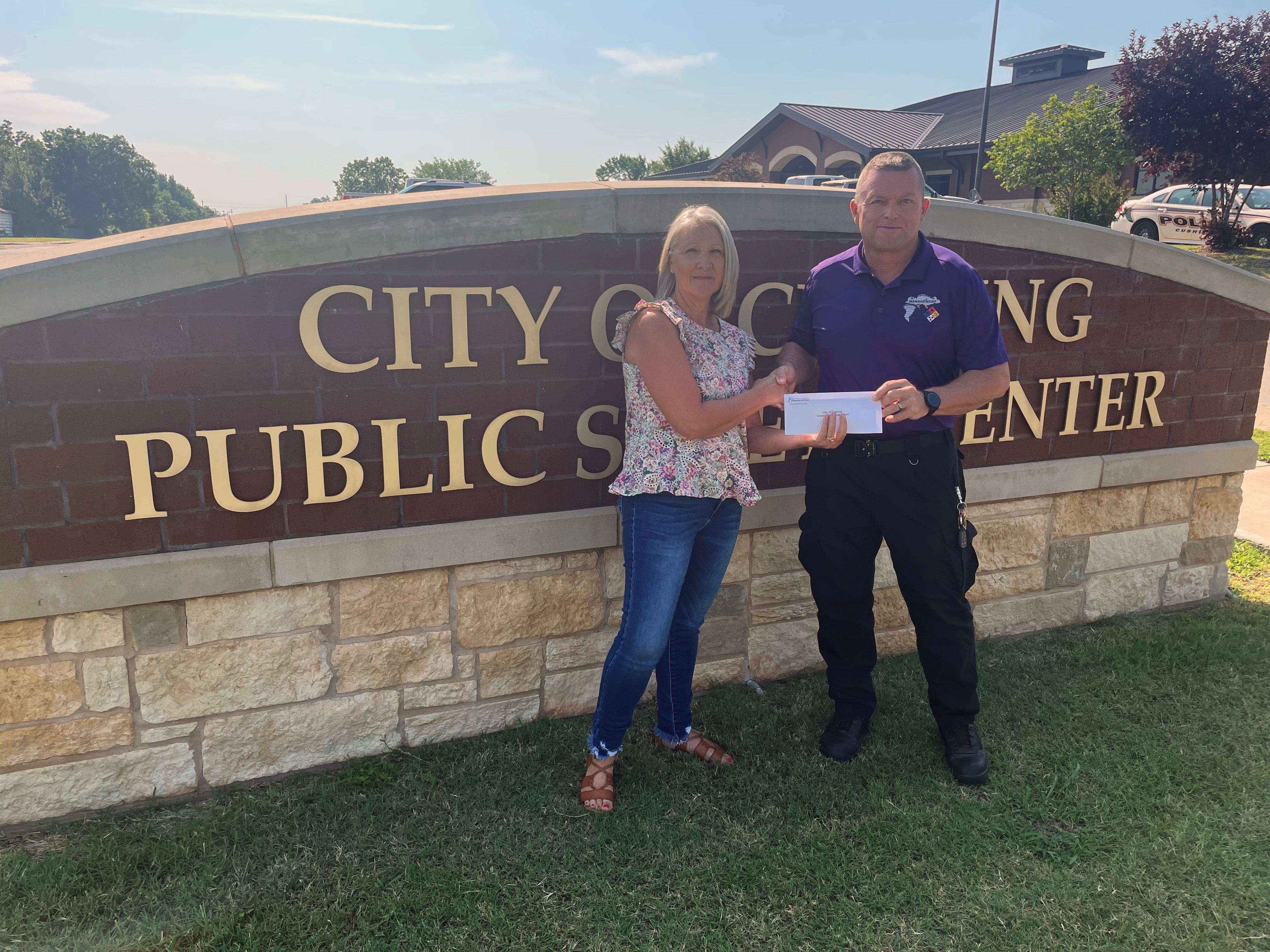 Pictured are Gail Cookerly, Central Community Foundation board member and Franklin Reed, Cushing Emergency Management Director.
