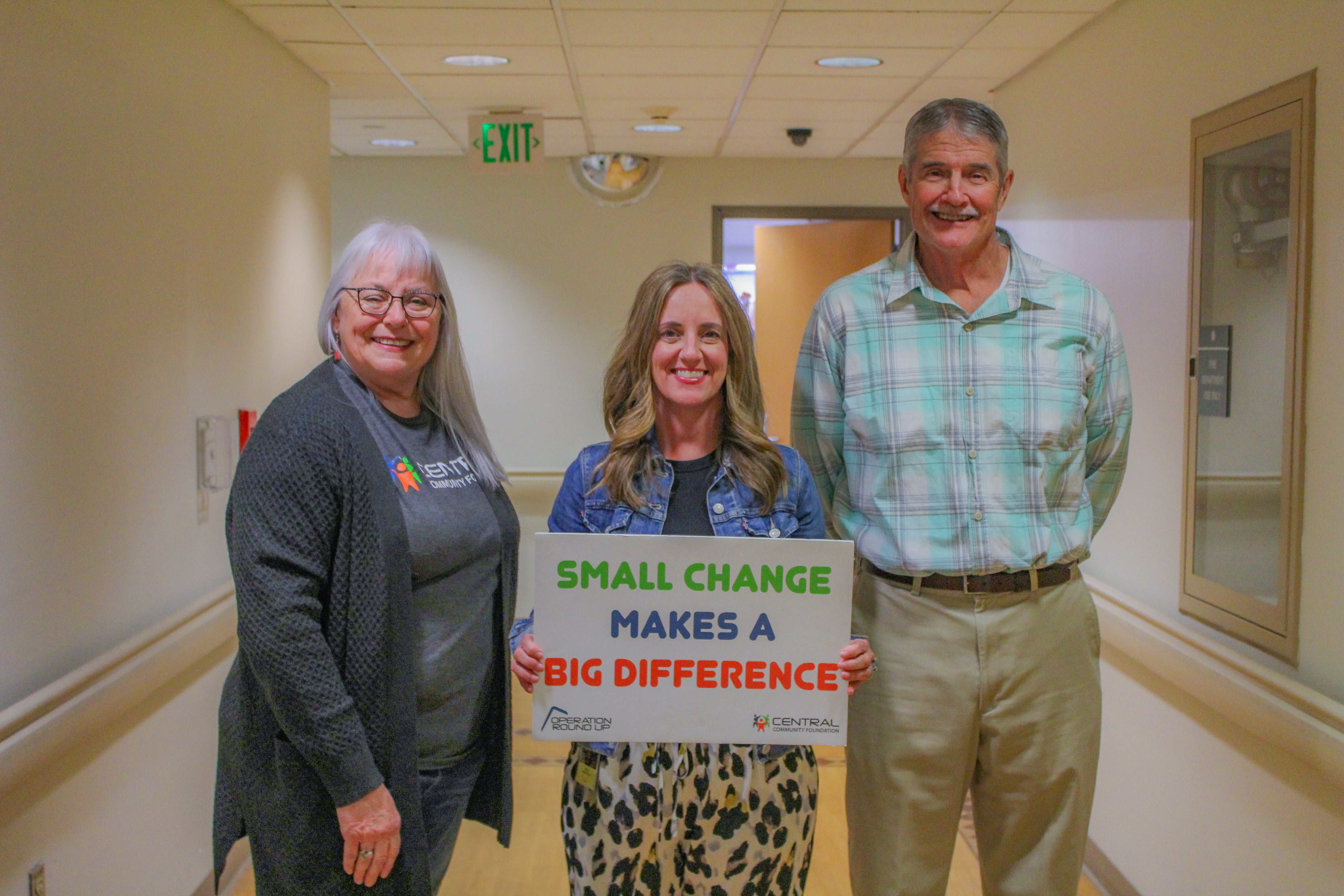 Central Community Foundation board member, Donna Dollins, presents Stillwater Mobile Meals executive director Neilly Thomas and board member Bob Hunger with a grant to cover program expenses.