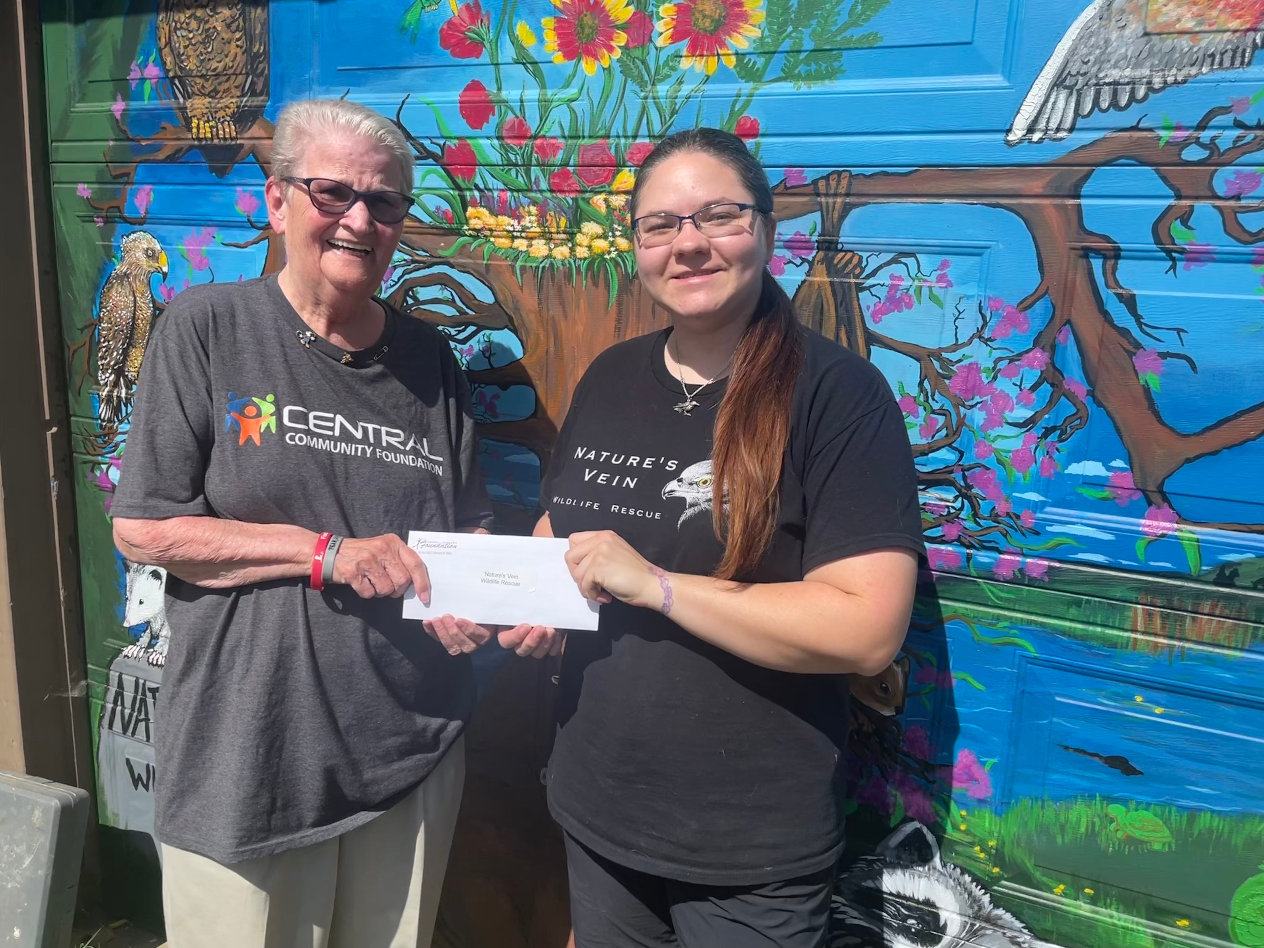 Pictured are Judy German, Central Community Foundation board member and Jessica Torres of Nature’s Vein Wildlife Rescue.
